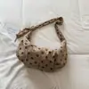 Bolsa de axila retro de lunares de nicho estilo coreano Shuai Mi Jia 2026 nueva bolsa de hombro para el trabajo bolsa cruzada casual para el trabajo