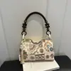 Bolsa pequeña bordada de estilo étnico para mujer, nuevo modelo 2026, nuevo bolso tipo cubo para teléfono móvil de estilo chino, bolso cruzado moderno y versátil