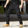 Pantalones casuales retro de camuflaje táctico impermeables de concha blanda sueltos para hombre de primavera/otoño, europeos y americanos, para exteriores