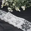 Borda de renda branca Tanglong, apresentando padrões florais delicados, leves e não elásticos, adequada para roupas, lingerie e como adorno para bordas de vestuário.