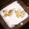 Pendientes de mariposa vintage exquisitos con incrustaciones de diamantes, pequeños y delicados con un toque de alta gama, clips para orejas con forma de espiral para mosquitos, pendientes simples versátiles europeos y americanos