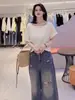 Camiseta de Manga Corta con Botón de Concha Estilo Coreano para Mujer, Nuevo Modelo Verano 2026, Elegante y Versátil, Top Holgado Adelgazante para Mujer