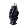 Calavera negra de Halloween sosteniendo una vela perfumada de rosa, vela decorativa con forma de calavera para ambiente de fiesta navideña