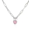 Collar transfronterizo europeo y americano de cobre chapado en oro de 18K con microincrustaciones de diamantes de colores en forma de corazón y lazo para mujer, dulce y versátil, venta al por mayor
