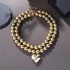 Collar Cibernético Europeo y Americano Transfronterizo Exagerado de Dos Piezas Multicapa de Cuentas Redondas Apiladas con Colgante de Corazón CCB Cadena para el Cuello