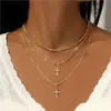 Moda de lujo transfronteriza europea y americana de alta gama, collar de traje, personalidad de nicho, cadena de suéter de cruz multicapa para mujer
