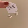 Pendientes para hombre con forma de estrella de amor cepillada esmerilada 2025 nuevo popular de lujo ligero alta gama pendientes con clip para oreja femenino nicho único