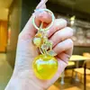 Accesorios creativos transfronterizos de mango y limón, llaveros de coche modernos y populares, colgantes de bolsa de frutas de alto valor