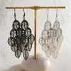 Pendientes de borla con hoja hueca minimalista transfronterizos europeos y americanos, pendientes de lujo ligero de alta gama, pendientes llamativos de moda y audaces