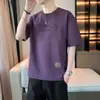 2026 Verano Nueva Camiseta de Manga Corta para Hombre Marca de Moda para Hombre Holgada Cuello Redondo Bordado de Letras Casual Versátil Moderna Media Manga
