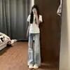 Calça Jeans Azul Claro de Cintura Baixa Micro Flare para Mulheres Verão 2026 Estilo Fino Garota Picante Caimento Solto Alargada na Barra Calça Flare