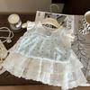 Ropa Infantil Estilo Coreano 2026 Nuevo Conjunto de Dos Piezas Verano Niñas: Chaleco de Mangas Volantes con Estampado Floral y Pantalones Falda con Tirantes y Ribete de Encaje Blanco