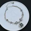 Pulsera Popular Transfronteriza Europea y Americana de Zirconia Negra Cruzada para Mujer Pulsera Retro Hip-Hop Flor de Iris Dropshipping