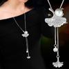 Collar largo de cadena para suéter con accesorios florales transfronterizos para mujer, colgante de borla de cristal, colgante para ropa, joyería simple al por mayor