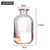 Procesamiento de botella de aroma de vidrio personalizada botella de aroma de vidrio de color degradado pequeño recipiente de fragancia de ratán adornos para dormitorio