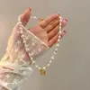 Colar de Pérolas Vintage Dourado Gelo Quebrado Pônei, Luxo Leve e Requintado, Versátil para o Ano do Cavalo, Corrente de Colar para Suéter do Ano do Zodíaco