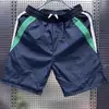 Shorts casuales de verano para hombres y mujeres, marca de moda ins holgados casuales de moda pantalones de longitud media, pantalones versátiles de estilo coreano de cinco puntos