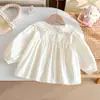 Camisa Coreana para Niña 2026 Nuevo Otoño Bebé Niña Lindo Bordado de Moño Encaje Cuello de Muñeca Top Moderno