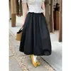 Falda tipo tulipán de lunares blancos estilo coreano con cintura elástica, versátil y estiliza, adecuada para figuras petite, falda de longitud media