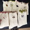 Meias sem costura estilo outono/inverno com borda de orelha de madeira, bolinhas de desenho animado, laço de areia, meias longas, meias com estampa de animal fofo, atacado Zhuji