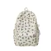 Mochila floral minimalista estilo bosque 2026 conjunto de tres piezas estilo campus transfronterizo mochila escolar para estudiantes de secundaria y preparatoria mochila de viaje