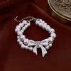 Pulsera y Collar de Doble Capa con Lazo de Perlas Cadena para Clavícula Estilo Palacio Francés Set de Joyería Versátil de Lujo Ligero para Mujeres
