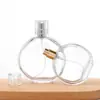 Botella de Perfume de Vidrio Transparente Redonda Plana de Bayoneta Más Vendida Botella Portátil de Spray de Presión Transfronteriza Botella Vacía para Decantar Aceites Esenciales de Viaje
