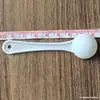 Venta al por mayor de fábrica cucharas pequeñas de plástico 1g 0.5g 0.25 gramos cuchara dosificadora de polvo mini cuchara medidora se puede imprimir LOGOTIPO