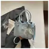 Bolsa de mão pequena requintada transfronteiriça para mulheres 2026 nova bolsa de ombro com padrão trançado para trabalho e deslocamento bolsa de ombro cruzada tipo balde