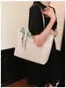 Bolso tote tejido vintage para mujer, modelo nuevo 2026, bolso de mano de gran capacidad para el trabajo con textura de piel sintética, bolso de moda para mujer al por mayor