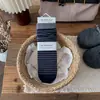 Calcetines de algodón y cachemira para mujer de otoño e invierno con rayas de contraste, de moda, estilo ins universitario, versátiles, cálidos, de media pantorrilla para niñas