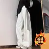 Calça de moletom listrada estilo americano para homens, nova calça esportiva de perna reta solta para primavera e outono, calça comprida casual da moda para meninos