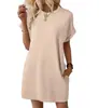 Vestido Casual de Verão 2026 Estilo Europeu e Americano Soltinho Gola Redonda Manga Curta Cor Sólida para Mulheres Casual Bolso Vestido Evasê Praia Casual