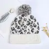 Nuevo gorro de punto de invierno al por mayor versión coreana del gorro de lana de leopardo bola directa cálido grueso en stock