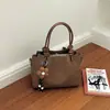 Bolso de mano retro elegante transfronterizo para mujer, nuevo bolso cruzado tipo cubo casual de moda, bolso de hombro cruzado para mujer trabajadora