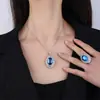 Huabi Joyería Base de Cobre Chapado en Oro Espinela Azul Tipo Hielo Fluorescente Forma de Huevo Conjunto de Temperamento Sencillo para Personaje Principal 13*18