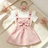 Amazon Nuevo Conjunto de Tres Piezas para Bebé y Niño Pequeño Estilo Europeo y Americano: Top Romper de Mangas Cortas Volantes, Camisola, Falda de Pana, Diadema