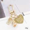 Yi Lian - Nuevo colgante de perla de aleación de zinc con forma de corazón, accesorio de joyería DIY, hebilla para puerta, pequeño colgante estilo Chanel para funda de teléfono móvil