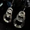 Pendientes Circulares Huecos Europeos y Americanos con Bobinado Transfronterizo, con un Toque Único de Alta Gama, Estilo de Moda de Nicho, Accesorios para Orejas Versátiles y Elegantes