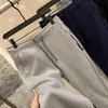 ¡Estilo de pierna cónica! ¡Tejido Toray de capa de aire! Bolsillos con cremallera color liso de moda versátiles pantalones casuales pantalones de chándal pantalones para hombre