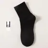 Meias para Homens e Mulheres Cano Longo Cor Sólida Desodorante Absorvente de Suor Respirável Esportivas Basquete Meias Masculinas Primavera e Outono Esportivas de Algodão Atacado