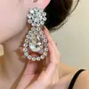 Pendientes de gota de agua incrustados con diamantes transfronterizos europeos y americanos, Pendientes sencillos y de moda, Lujo ligero, Sensación de alta gama, Accesorios para orejas inspirados en el diseño