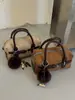 Bolso de mano moderno y minimalista con un diseño único, nueva colección 2026, moderno y elegante, versátil bolso de hombro y bolso cruzado, bolso pequeño cuadrado estilo coreano