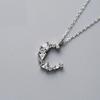 Collar de media luna de temperamento simple, personalidad de estilo japonés y coreano, Mori dulce, combina con todo, cadena de clavícula de luna estrella, suministro de comercio exterior