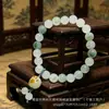 Pulsera de Jade Dorado de Xinjiang al por Mayor Accesorios de Cuentas Redondas de Jade del Gobi Pulsera Unisex de Jade Verde de Tianshan Fuente de Suministro para Transmisiones en Vivo