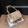 Bolso de mano casual elegante Shuai Mi Jia para mujer, nuevo modelo principios de otoño 2026, bolso cuadrado pequeño simple, bolso bandolera de moda