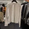 Camisa casual versátil de manga larga con textura de gofre y abertura pequeña, nuevo estilo 2026, Dongdaemun Corea