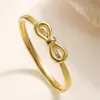 Pulsera Aogu Transfronteriza Simple y Única Chapada en Oro de 18K con Circonita y Moño de Acero Inoxidable para Mujer, Joyería Personalizada de Nicho