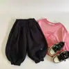 Pantalones casuales para niños estilo coreano, nueva colección otoño 2026, pantalones de tobillo cónico, corte holgado, pantalones largos versátiles para bebés