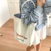Bolsa de Grande Capacidade Feminina 2025 Verão Nova Bolsa de Ombro de Lona Listrada Dupla Face Casual Versátil Bolsa Tote